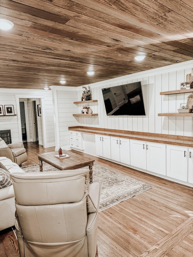 233 Garner Ln, Lawrenceburg, TN 38464 - living room with a fireplace, light wood finished floors, wood walls, and wood ceiling