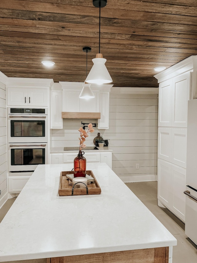 233 Garner Ln, Lawrenceburg, TN 38464 - kitchen with wooden ceiling, white appliances, a center island, white cabinetry, and light countertops