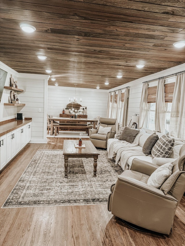 233 Garner Ln, Lawrenceburg, TN 38464 - living area with a chandelier, wood finished floors, and wood ceiling
