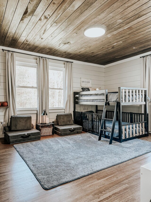 233 Garner Ln, Lawrenceburg, TN 38464 - bedroom featuring wood ceiling, wooden walls, wood finished floors, and ornamental molding