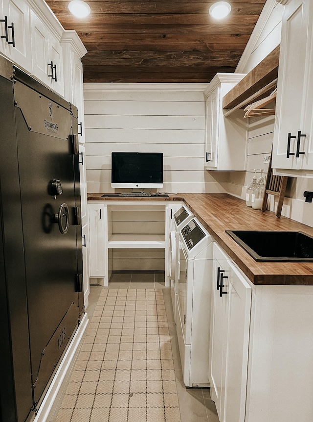 233 Garner Ln, Lawrenceburg, TN 38464 - kitchen with refrigerator, wood ceiling, butcher block counters, washing machine and clothes dryer, and white cabinets