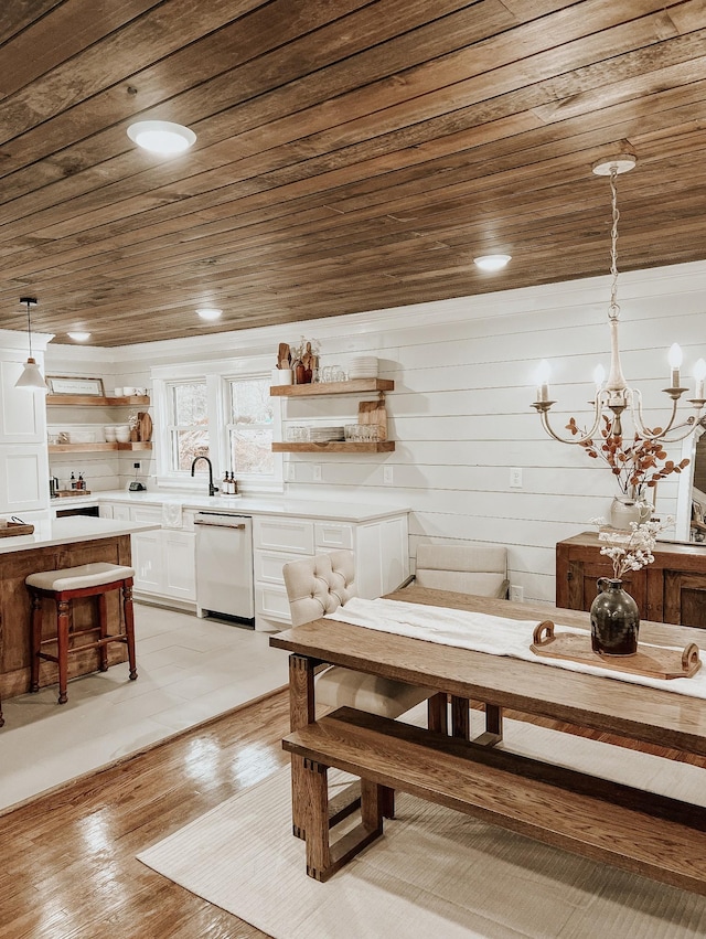 233 Garner Ln, Lawrenceburg, TN 38464 - dining room featuring light wood-type flooring, a notable chandelier, and wooden ceiling