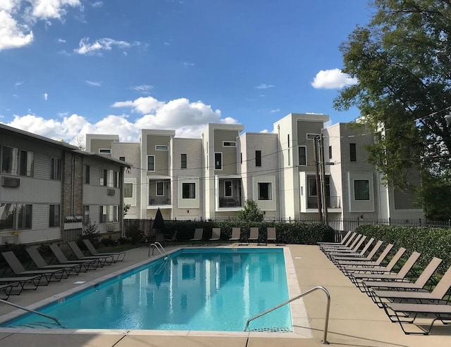 community pool featuring fence