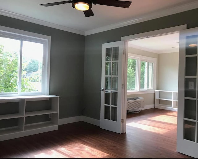 spare room featuring dark wood-style floors, a ceiling fan, crown molding, and a wall mounted AC