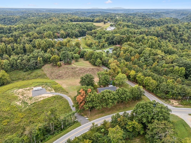 drone / aerial view with a view of trees