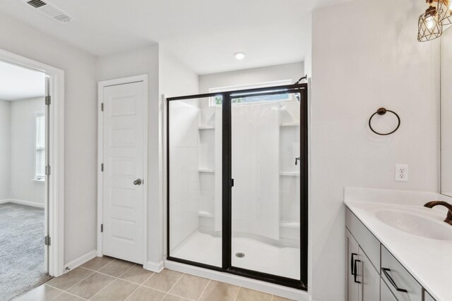 3227 Brookberry Ln, Murfreesboro, TN 37129 - bathroom featuring a shower stall, vanity, baseboards, and tile patterned flooring