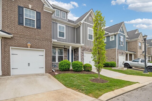 3227 Brookberry Ln, Murfreesboro, TN 37129 - view of property featuring board and batten siding, a garage, concrete driveway, a residential view, and stone siding