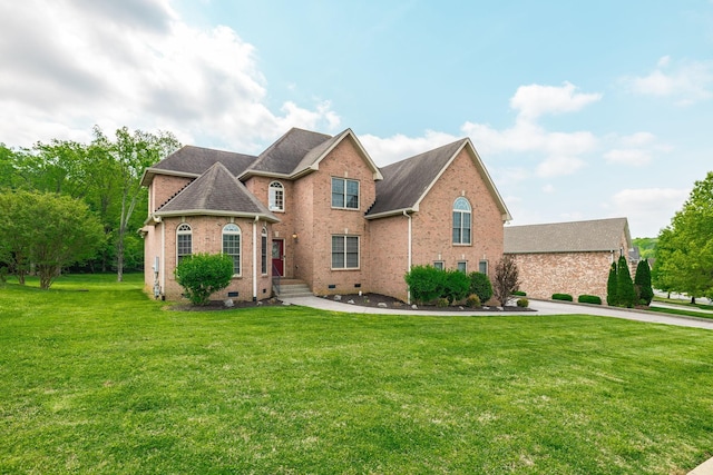 view of front of home with roof with shingles, crawl space, brick siding, and a front yard