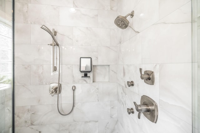 bathroom with tiled shower