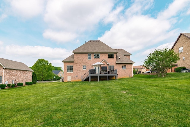 rear view of property featuring a wooden deck, a yard, stairway, and brick siding