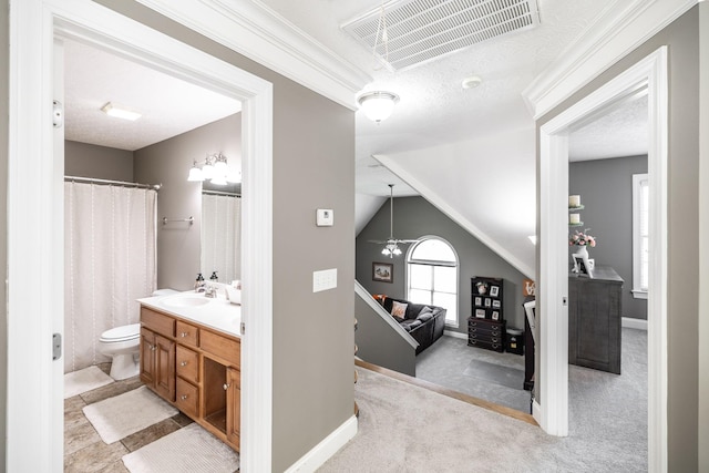 full bath with visible vents, crown molding, vanity, toilet, and baseboards