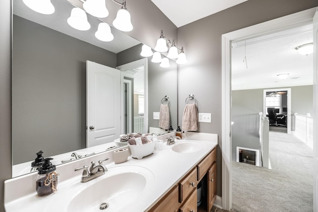 bathroom featuring double vanity and a sink