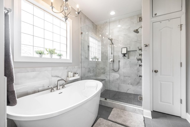 full bathroom with a freestanding bath, tile patterned floors, a stall shower, and recessed lighting