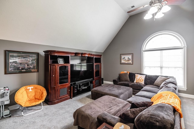 carpeted living area with ceiling fan, visible vents, baseboards, and lofted ceiling