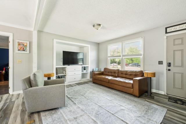 2608 Walnut Ln, Murfreesboro, TN 37129 - living room featuring a textured ceiling, wood finished floors, and baseboards