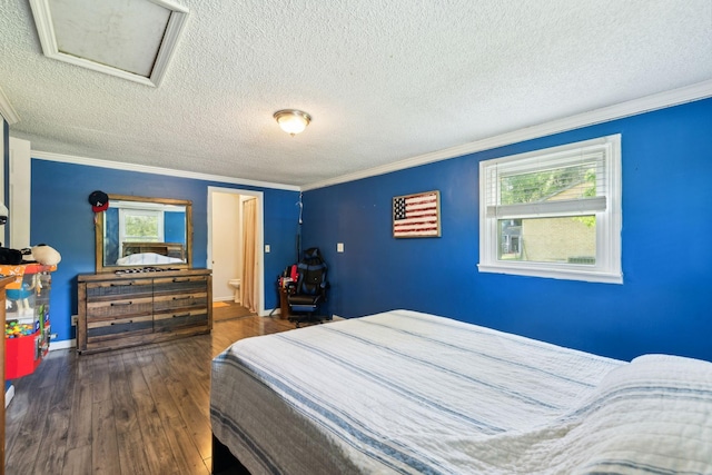 2608 Walnut Ln, Murfreesboro, TN 37129 - bedroom featuring hardwood / wood-style floors, ornamental molding, attic access, and a textured ceiling