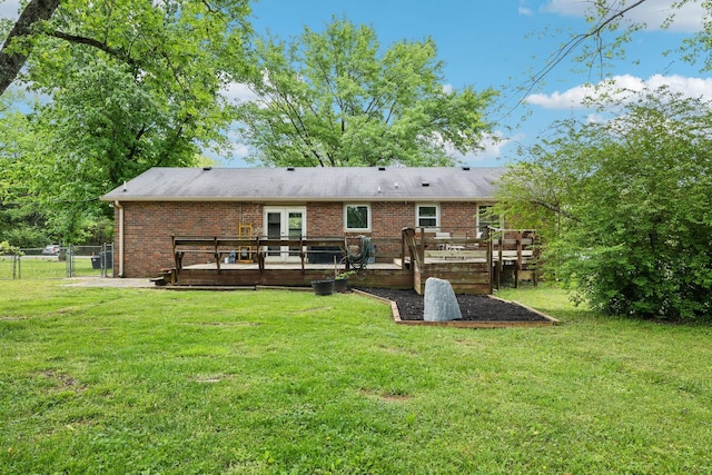 2608 Walnut Ln, Murfreesboro, TN 37129 - back of property with a gate, brick siding, fence, a wooden deck, and a lawn