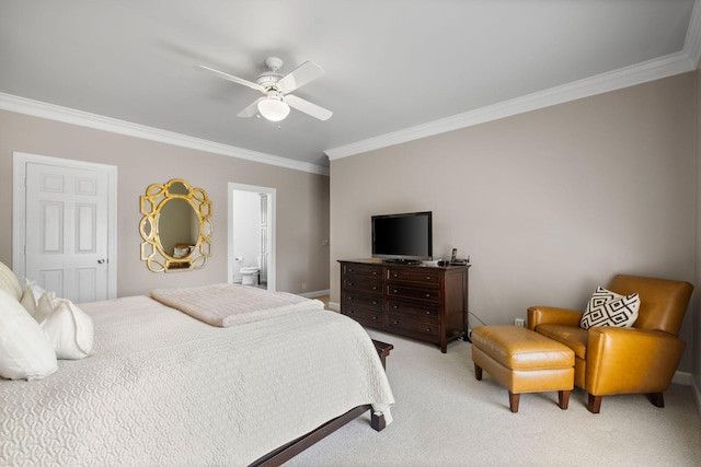 bedroom featuring light colored carpet, ornamental molding, ensuite bathroom, baseboards, and a ceiling fan