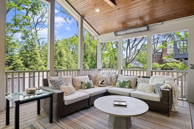sunroom featuring an outdoor living space