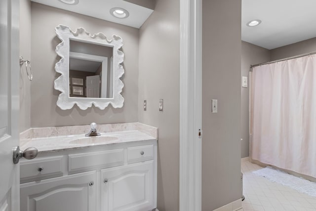 bathroom with recessed lighting, tile patterned flooring, a shower with shower curtain, vanity, and baseboards