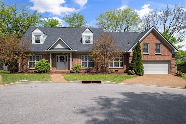 cape cod-style house featuring a front yard, driveway, an attached garage, and brick siding