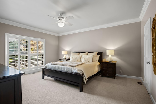 bedroom with ceiling fan, baseboards, ornamental molding, and light carpet