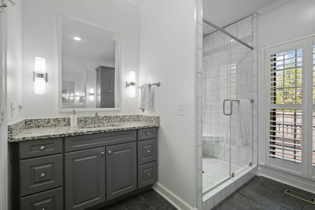 bathroom with crown molding, a stall shower, visible vents, baseboards, and tile patterned flooring