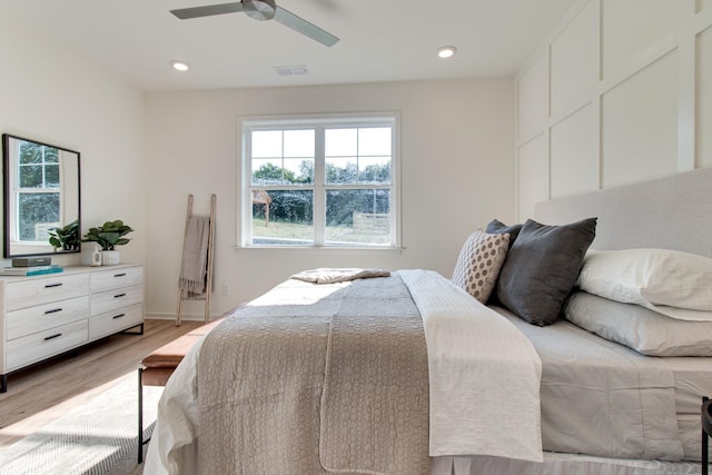 bedroom with recessed lighting, light wood-type flooring, baseboards, visible vents, and a ceiling fan