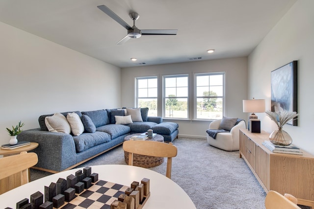 carpeted living room with recessed lighting, visible vents, ceiling fan, and baseboards