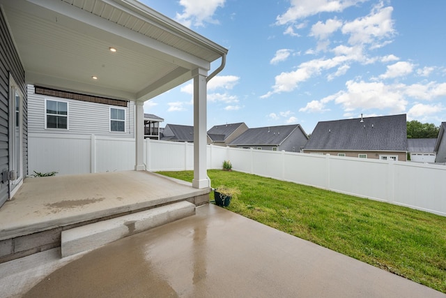 view of patio featuring a residential view and a fenced backyard