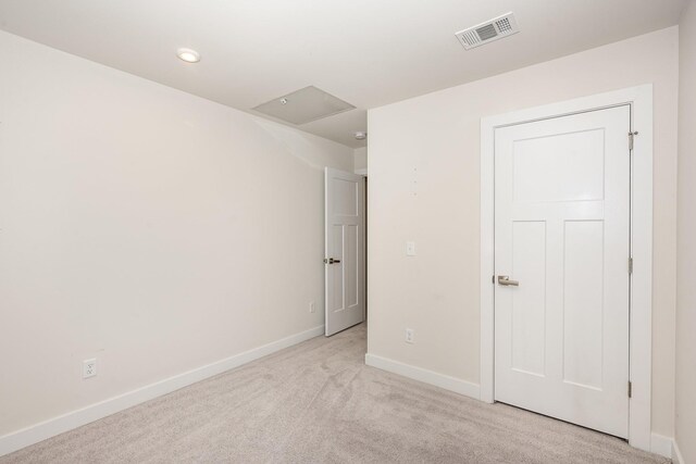 unfurnished bedroom featuring recessed lighting, baseboards, visible vents, and light carpet