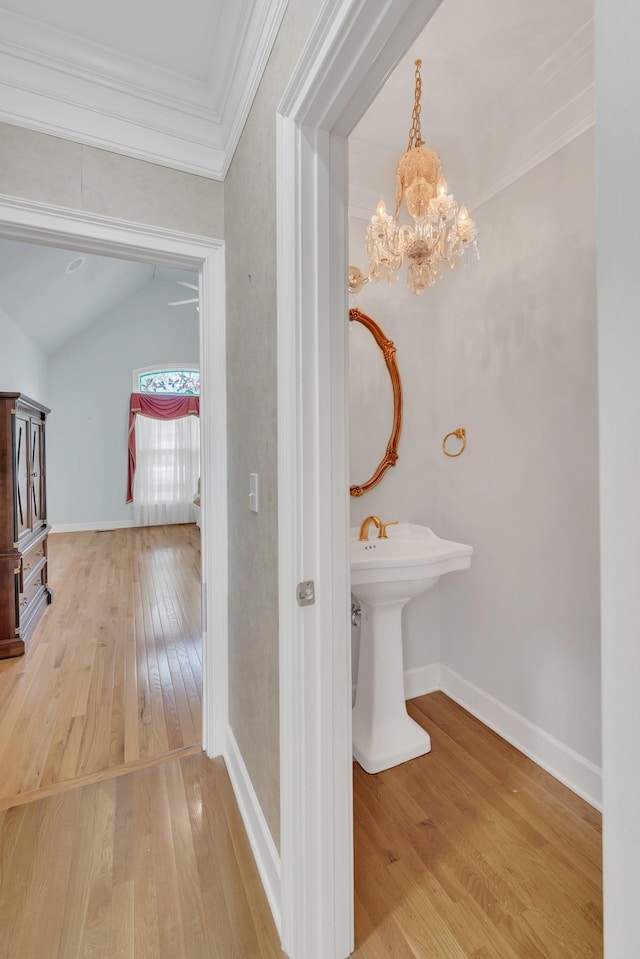 5112 Herschel Spears Cir, Brentwood, TN 37027 - bathroom with wood-type flooring, a notable chandelier, vaulted ceiling, baseboards, and ornamental molding