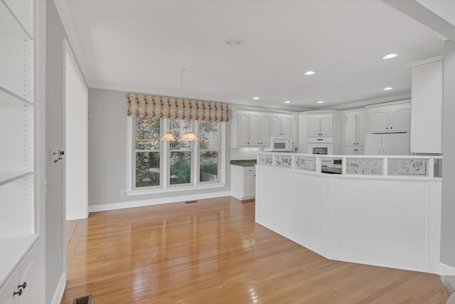 5112 Herschel Spears Cir, Brentwood, TN 37027 - kitchen with recessed lighting, white appliances, light wood-style flooring, white cabinets, and baseboards