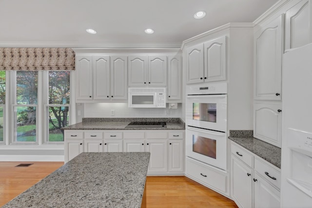 5112 Herschel Spears Cir, Brentwood, TN 37027 - kitchen with white cabinets, white appliances, and dark stone counters