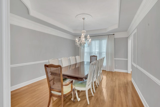 5112 Herschel Spears Cir, Brentwood, TN 37027 - dining room with an inviting chandelier, light wood-style floors, a tray ceiling, and baseboards