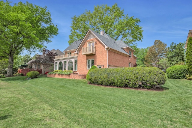 5112 Herschel Spears Cir, Brentwood, TN 37027 - rear view of house featuring brick siding, a yard, a chimney, and a balcony