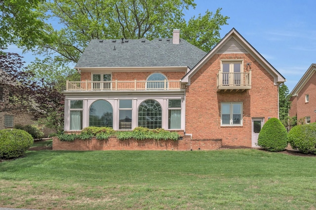 5112 Herschel Spears Cir, Brentwood, TN 37027 - back of property with a lawn, a chimney, a balcony, and brick siding