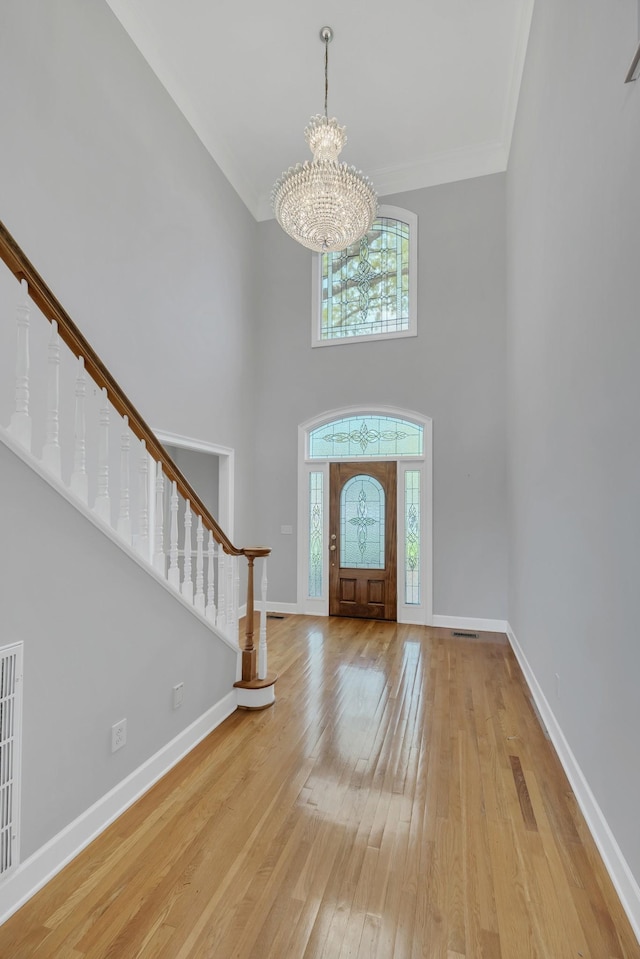 5112 Herschel Spears Cir, Brentwood, TN 37027 - foyer featuring stairway, ornamental molding, a notable chandelier, and light wood finished floors