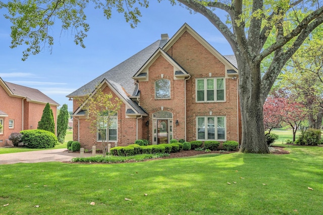 5112 Herschel Spears Cir, Brentwood, TN 37027 - traditional-style house featuring a chimney, brick siding, and a front yard