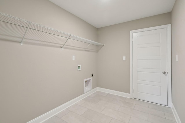laundry area featuring light tile patterned flooring, laundry area, electric dryer hookup, hookup for a washing machine, and baseboards