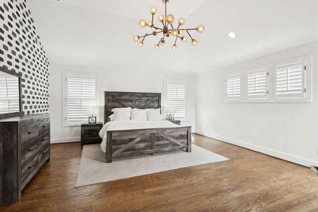 bedroom with baseboards, a notable chandelier, dark wood finished floors, and vaulted ceiling