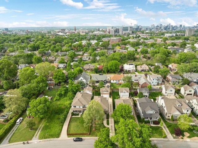 birds eye view of property featuring a view of city and a residential view