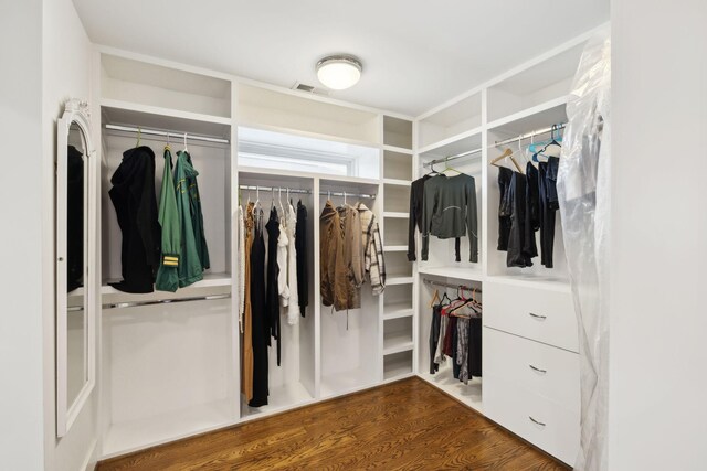 walk in closet featuring wood finished floors and visible vents