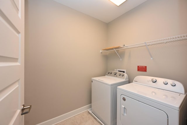 141 Saundersville Rd Unit 1305, Hendersonville, TN 37075 - laundry area featuring light tile patterned floors, separate washer and dryer, laundry area, and baseboards