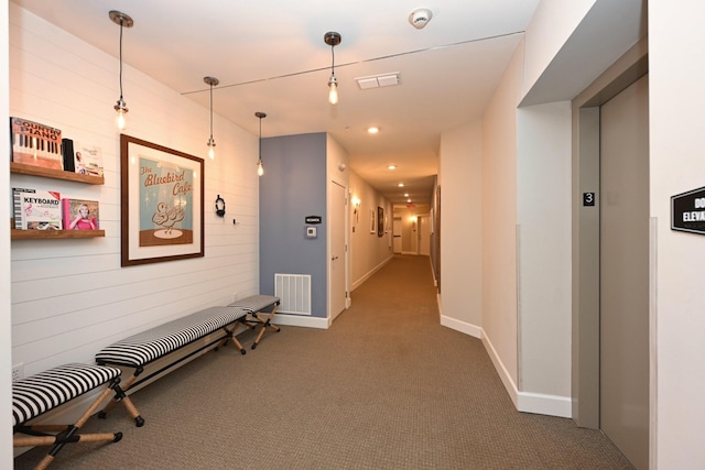 141 Saundersville Rd Unit 1305, Hendersonville, TN 37075 - hallway with baseboards, visible vents, elevator, and carpet