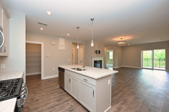 141 Saundersville Rd Unit 1305, Hendersonville, TN 37075 - kitchen with a kitchen island with sink, a sink, appliances with stainless steel finishes, open floor plan, and dark wood finished floors