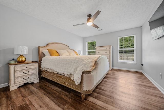 2011 Mccrory Pl, Spring Hill, TN 37174 - bedroom with baseboards, visible vents, a textured ceiling, and dark wood-style flooring