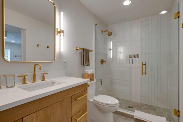 full bath featuring toilet, a stall shower, recessed lighting, and vanity