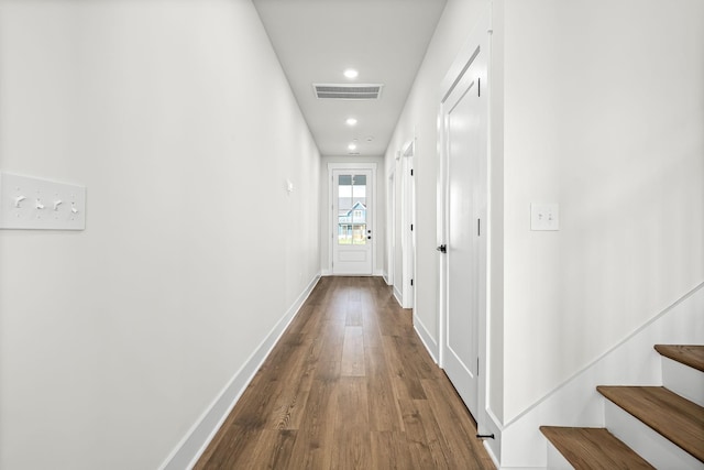 hallway with recessed lighting, stairs, baseboards, visible vents, and dark wood-type flooring