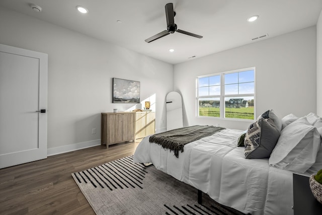 bedroom featuring recessed lighting, ceiling fan, visible vents, baseboards, and wood finished floors